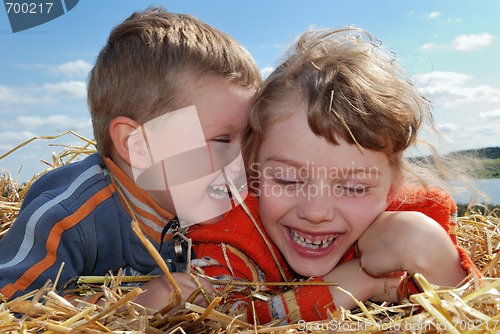 Image of laughing Boy and girl outdoors