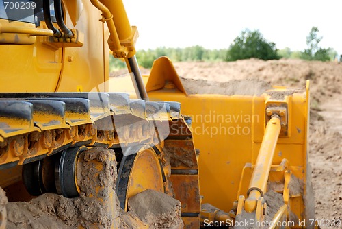 Image of bulldozer track in action