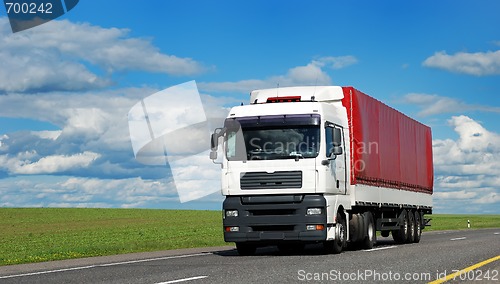 Image of white lorry with red trailer