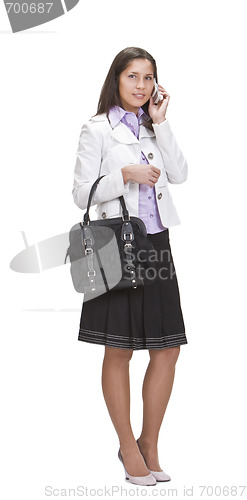 Image of Casually dressed woman speaking on the phone