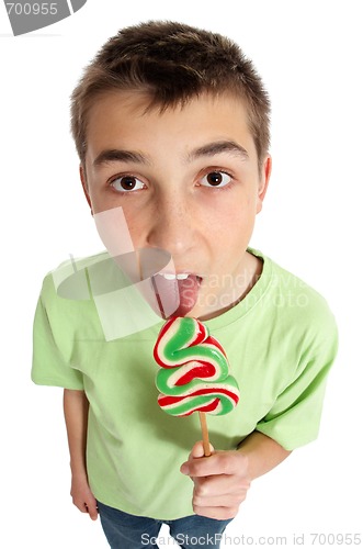 Image of Boy licking lollipop