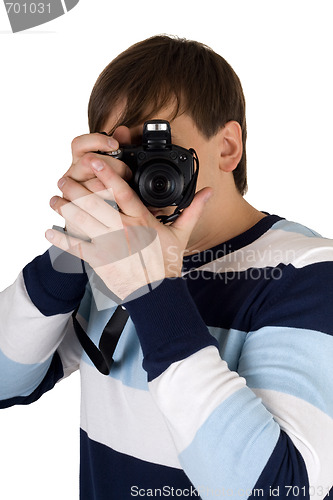 Image of Young man with a camera. Isolated on white