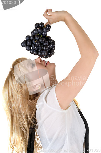 Image of Portrait of the smiling girl with grapes cluster. Isolated
