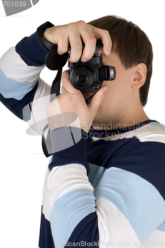 Image of Young man with a digital camera. Isolated on white