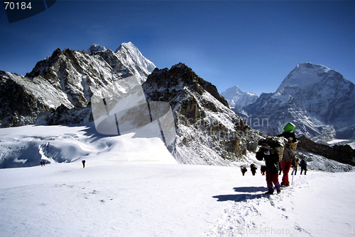 Image of Climbers and sherpas on glacier