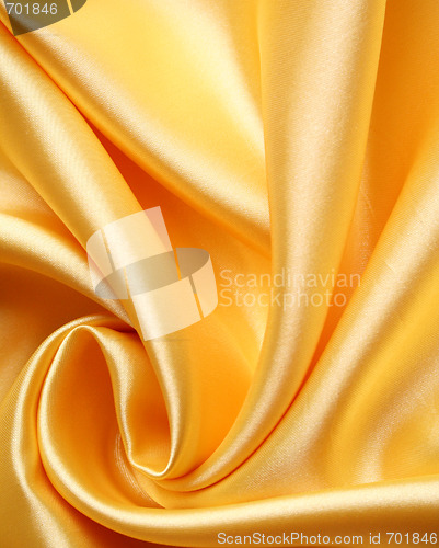 Image of Smooth elegant golden satin as background 