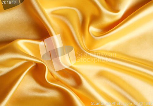 Image of Smooth elegant golden satin as background 