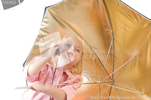 Image of Little girl talking on the phone
