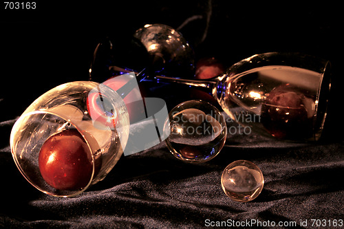 Image of Glasses with plums both crystal and glass spheres 