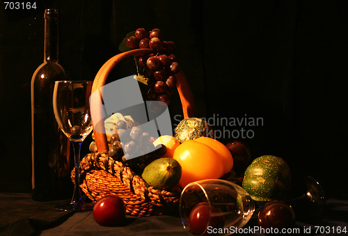 Image of Classical composition: glasses with basket of grapes and vegetab