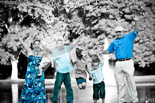 Image of Happy Family Jumping