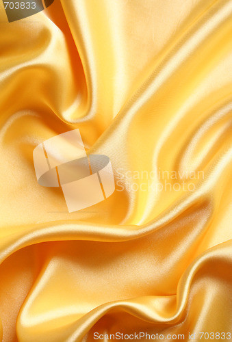 Image of Smooth elegant golden satin as background 