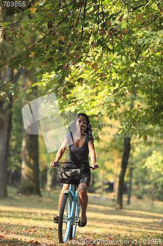 Image of Woman riding a bicycle