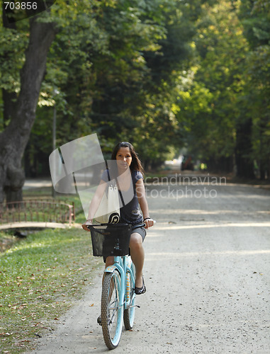 Image of Woman riding a bicycle