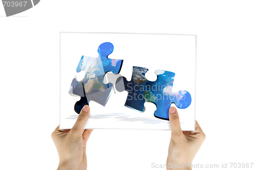 Image of photo of global map puzzles communication