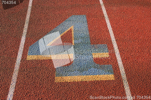 Image of Number Four on a Running Lane