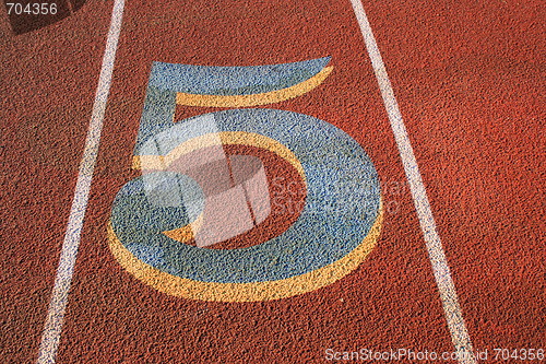Image of Number Five on a Running Lane