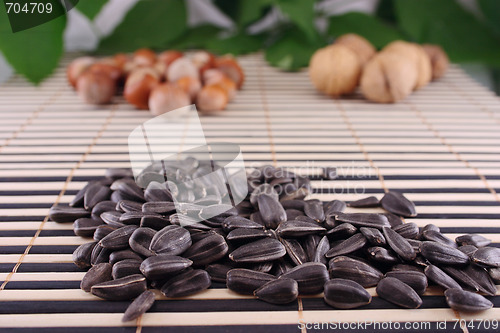 Image of Sunflower seeds on a striped bamboo napkin