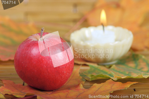 Image of Red apple from candles on a background