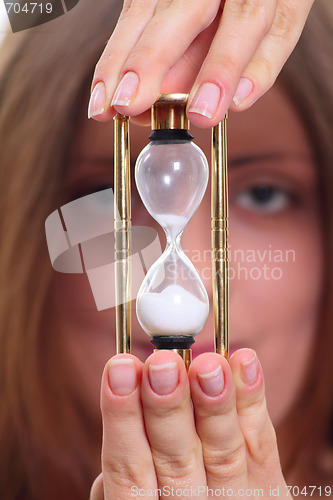 Image of The girl with a sand clock