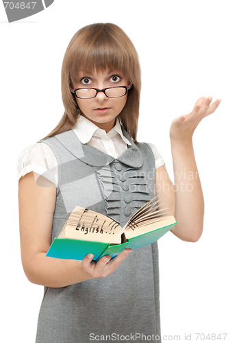 Image of Young girl reads english and is amazed
