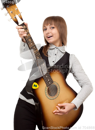 Image of Young girl with guitar sings