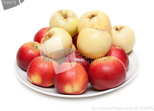 Image of Red and yellow apple on plate