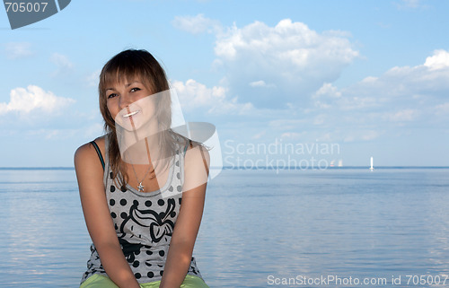 Image of Girl on background sky, sea and sailfish