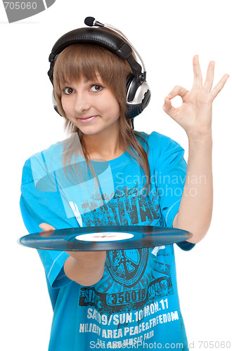 Image of Girl in earphone with vinyl disk in hand, ok