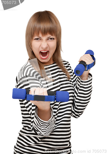 Image of Young girl with dumbbell yells