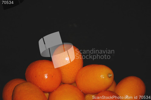 Image of orange fruit on black
