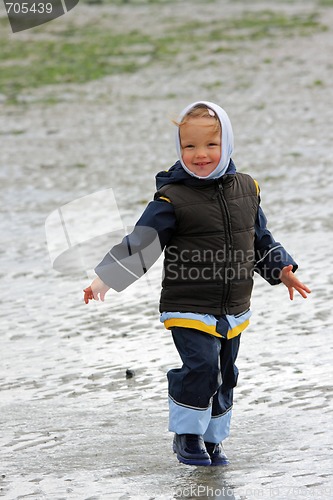 Image of little girl on low tide tideland