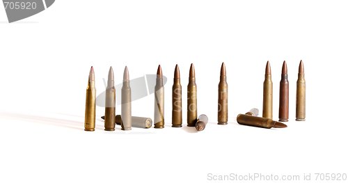 Image of Row of standing  M16 cartridges with some fallen isolated