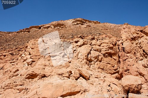 Image of Red rocky hill in the desert landscape