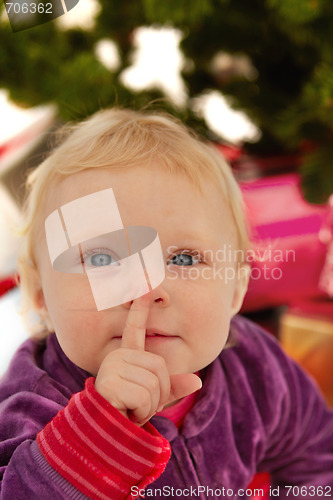 Image of Cute baby saying shhh - at christmas