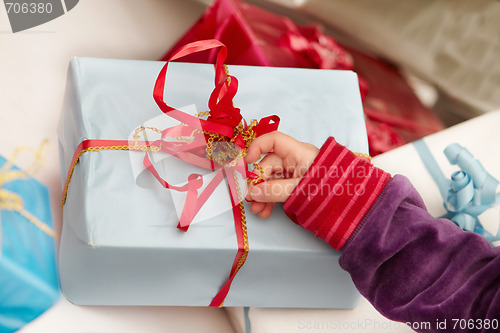 Image of Christmas time -  opening of presents