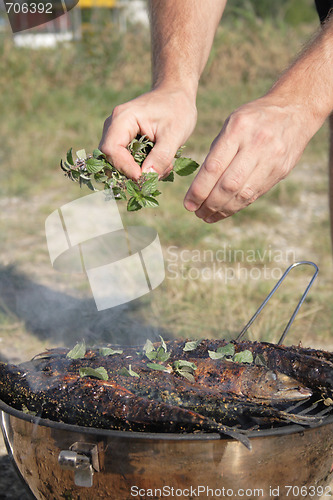 Image of preparing grilled fishes 