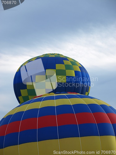 Image of Two  balloons lifting off