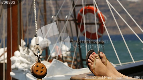 Image of Woman sunbathing on the yacht