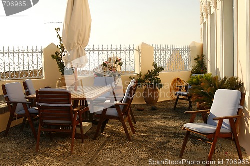 Image of Cozy romantic balcony in a house on Greek island Santorini