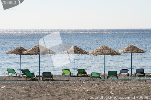 Image of Beach with chairs and umbrellas, Santorini island, Greece