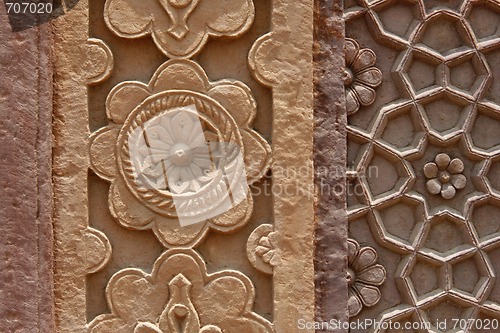 Image of Stone carvings on the wall of a temple in India