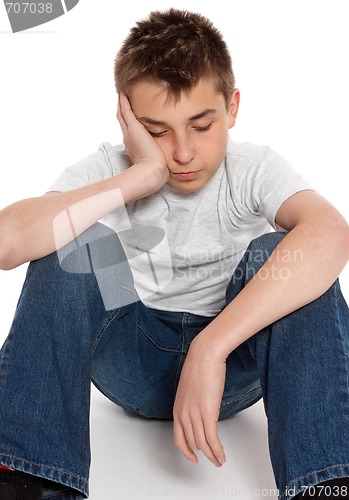 Image of Bored, lonely, tired, depressed boy sitting