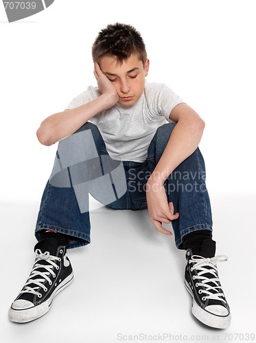 Image of Sad, loney, depressed or listless boy sitting