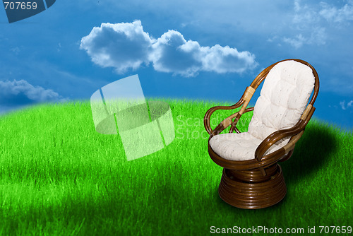 Image of Rocking chair on green grass 