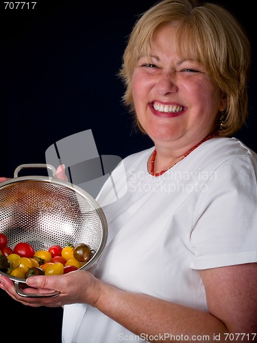 Image of Mature Woman with tomatoes