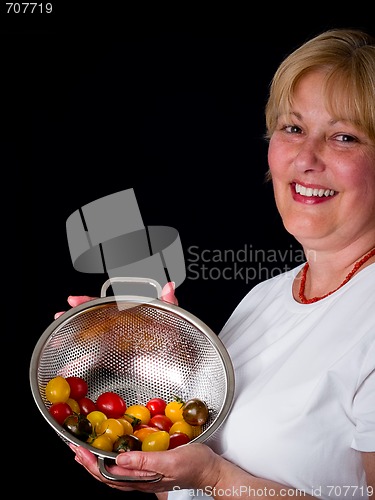 Image of Mature Woman with tomatoes
