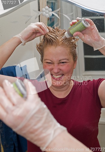 Image of  Mature Woman dyeing hair