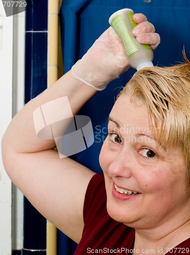 Image of Mature Woman Dyeing Hair