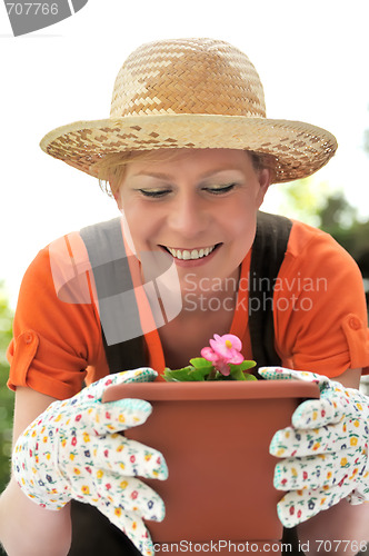 Image of Young woman - gardening